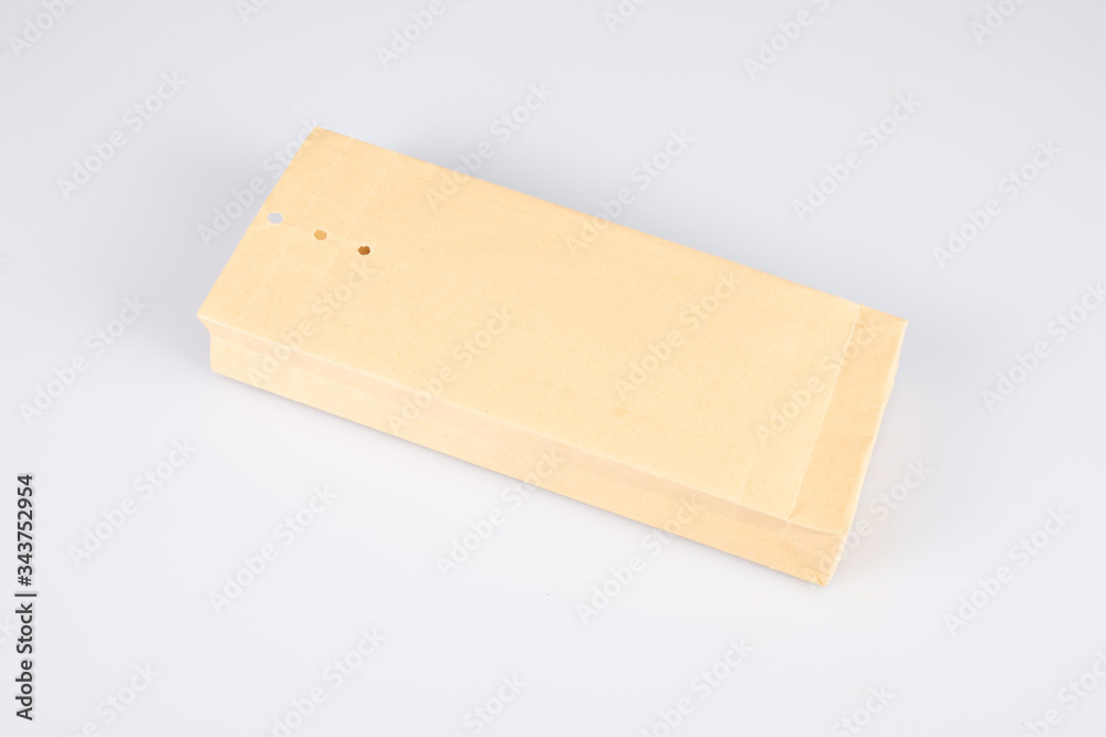 Kraft paper envelope folder perforated closure isolated on white background Kraft paper envelope folder perforated closure isolated on white background