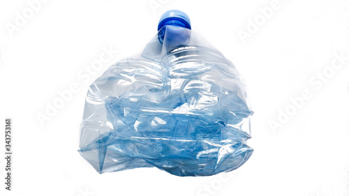 crumpled damaged plastic bottle for drinking water isolate on white background. Ecology, recyclables, waste sorting
