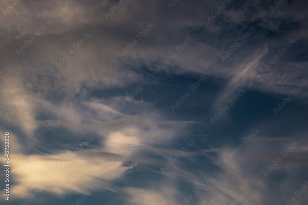 Naklejka premium Blue sky background with big tiny stratus cirrus striped cloud before storm.