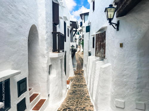 View of the alleys of the fishing village of Binibeca Vell, Menorca, Spain