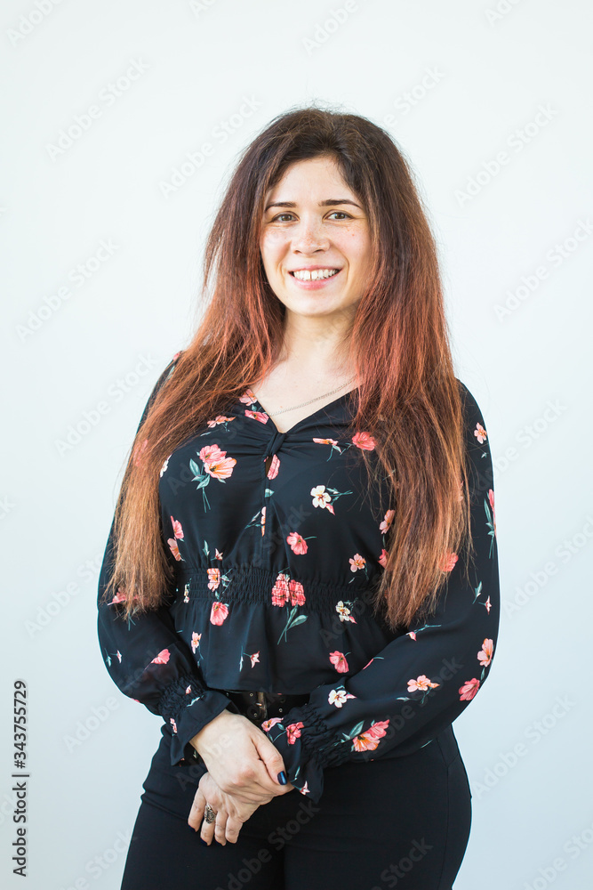 Close up portrait of funny attractive pretty girl with long ginger fair hair standing on white background. Close up portrait of funny attractive pretty girl with long ginger fair hair standing on white background.