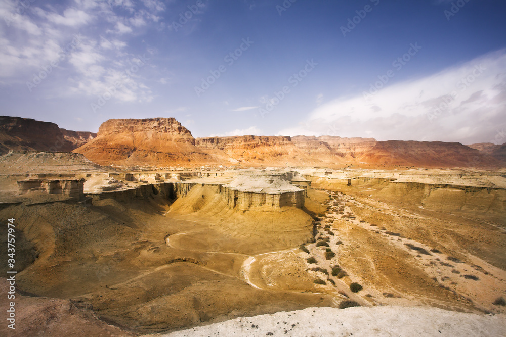 Huge dry sandy canyon in ancient mountains