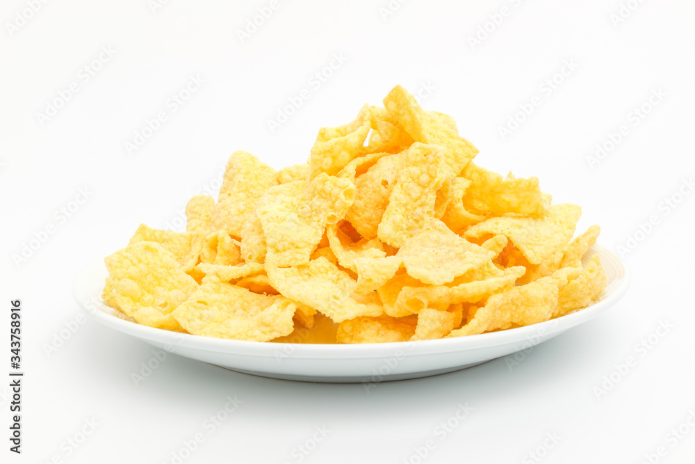 Chips made of corn on a white background Chips made of corn on a white background