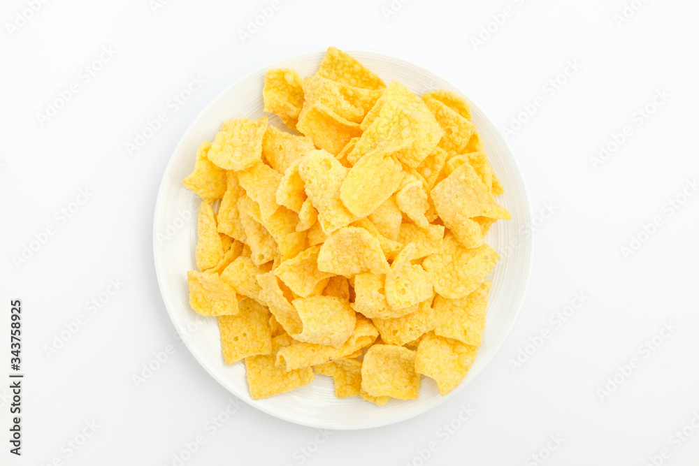 Chips made of corn on a white background Chips made of corn on a white background