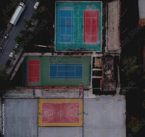 Aerial drone shot over basketball courts in a sports complex in Poseidonio, Thessaloniki Greece