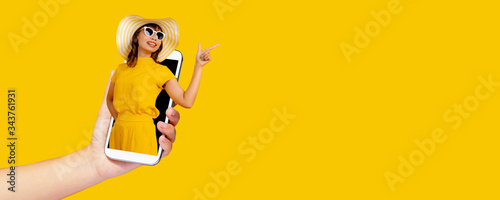 shopping online and presentation product, life style woman portrait on phone point out on yellow copy space © khwanchai