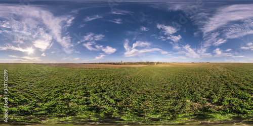 full seamless spherical hdri panorama 360 degrees angle view on among fields in spring evening with awesome clouds in equirectangular projection  ready for VR AR virtual reality content