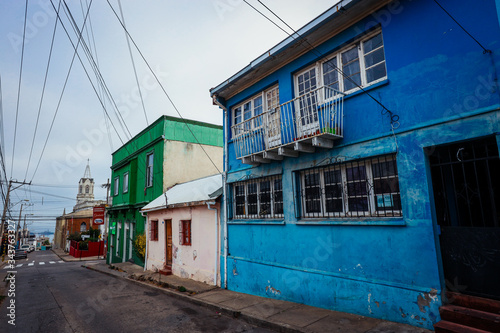 Valparaiso, Chile - March 08, 2020: Multi Colored Buildings with Bright Painting on the Street