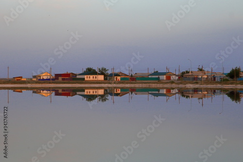 Aralsk village and their reflection on the water