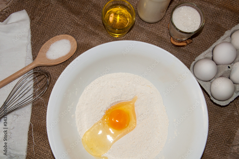 ingredients for dough and baking prepearing pancakes ,flitters,dumplings, vareniks from eggs,flour,milk,salt,sugar and eggs ingredients for dough and baking prepearing pancakes ,flitters,dumplings, vareniks from eggs,flour,milk,salt,sugar and eggs