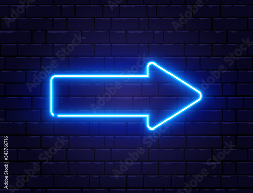 Arrow blue neon on brick wall. Realistic shining signboard. Glowing arrow pointer icon. Color neon banner. Night bright advertising. Vector illustration
