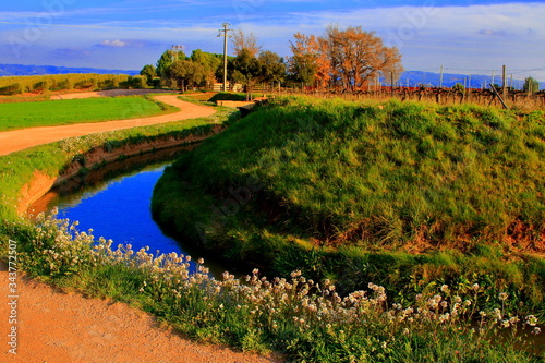 Walking way next to an aqueduct in the area of Pla del Bages with end in the Parc de la Sequia