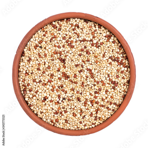 Mixed quinoa seeds in a bowl isolated on a white background. View from above.