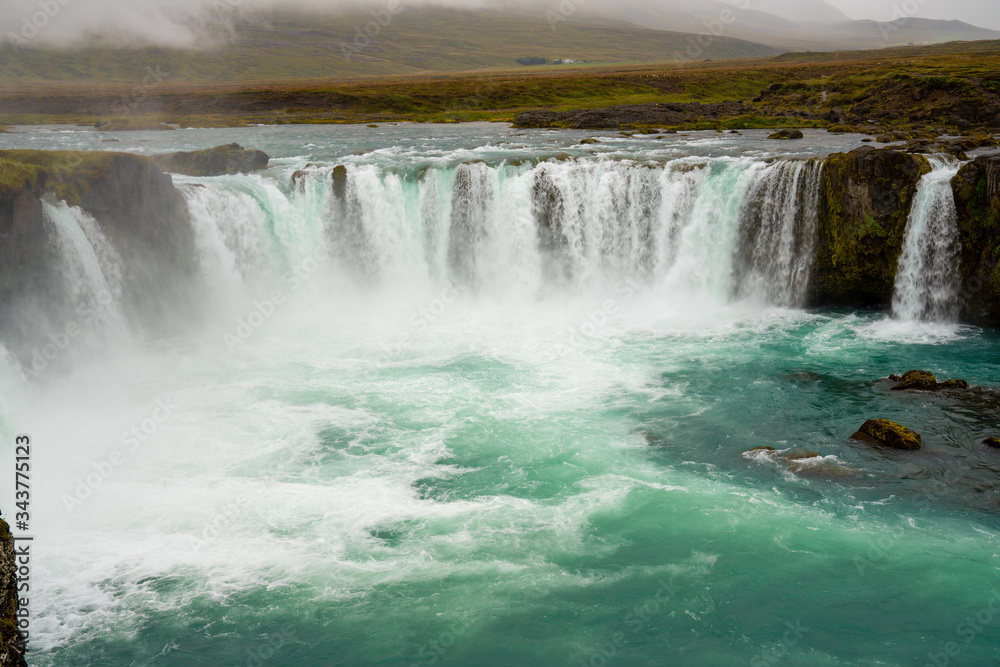 The Godafoss Icelandic: Goðafoss waterfall of the gods, is a famous waterfall in Iceland. The Godafoss Icelandic: Goðafoss waterfall of the gods, is a famous waterfall in Iceland.