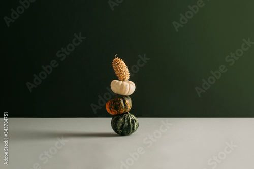 Stack of pumpkins on table