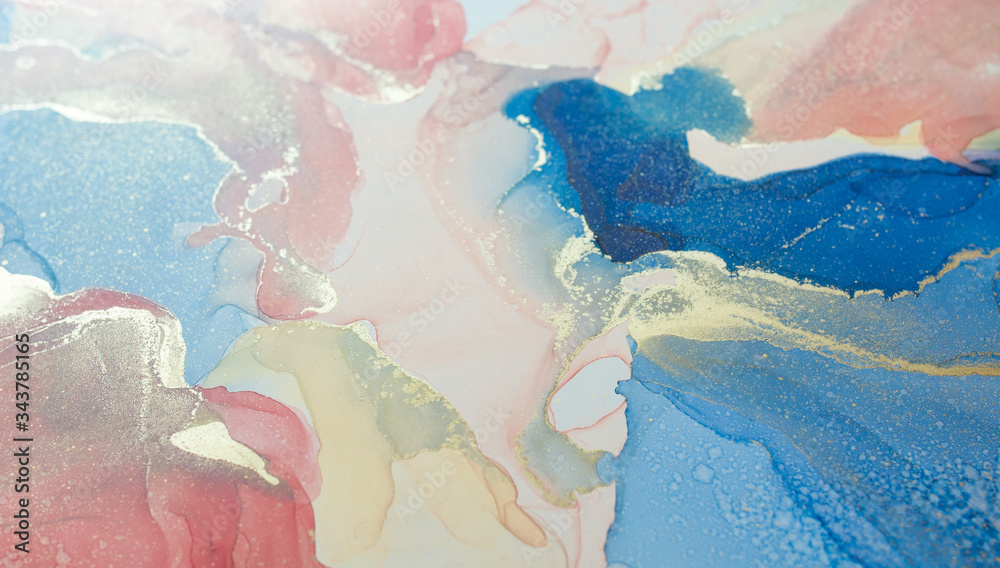 A fragment of alcohol ink painting (coral, blue and gold colors). Abstract colorful background, wallpaper. Mixing acrylic paints. Modern art. Marble texture. Alcohol ink colors translucent. Abstract c
