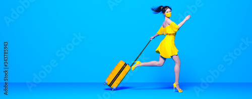Girl with suitcase on wheels runs away from coronavirus.