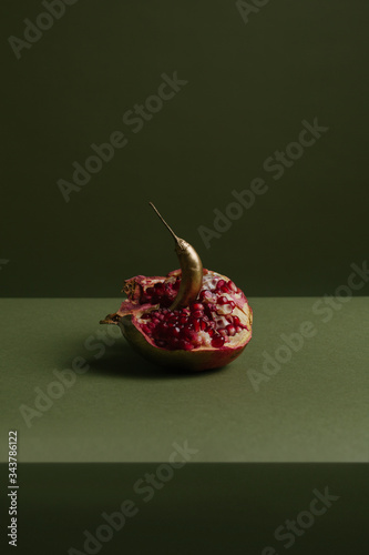 Pomegranate with chili on table
