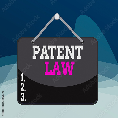 Writing note showing Patent Law. Business concept for deals with an inventor s is exclusive right to use own invention Memo reminder empty board attached background rectangle