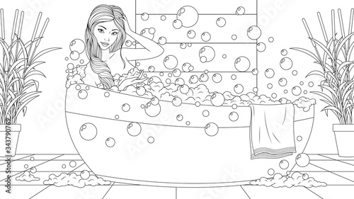 Beautiful girl bathes in the bathroom