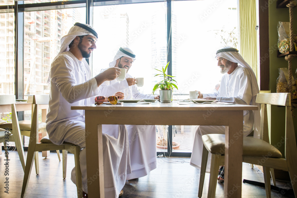 Arabian businessmen at restaurant cafè