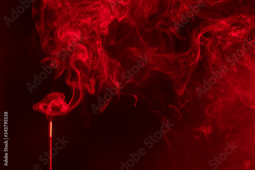Aroma sticks incense with realistic smoke. Indian aromatherapy and meditation ,red colour.
