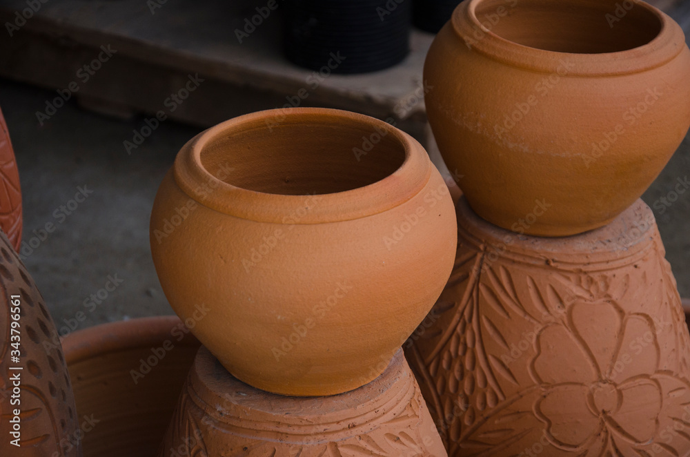 Beautiful brown baked clay jars on the pots Beautiful brown baked clay jars on the pots