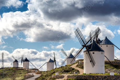 View of a group of old windmills, located on a hill near the town of Consuegra (Spain), on the traditional route of the Cervantes mills (Don Quixote).