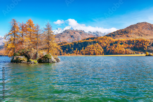 Fantastic autumn views of Sils Lake (Silsersee) with small islands.