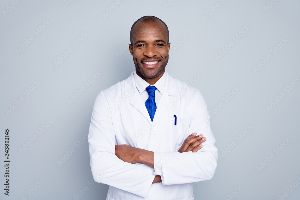 Photo of cheerful doctor dark skin guy virologist agent corona virus seminar conference arms crossed pandemic virus expert wear white lab coat tie isolated grey color background Photo of cheerful doctor dark skin guy virologist agent corona virus seminar conference arms crossed pandemic virus expert wear white lab coat tie isolated grey color background