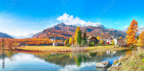 Spectacular autumn scene of Sils im Engadin (Segl) village and  Sils Lake (Silsersee). photo