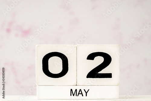 White cube calendar for May with copy space