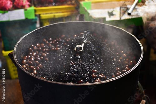 Canvas Print Roasted chestnuts for sale on the streets of Kuala Lumpur