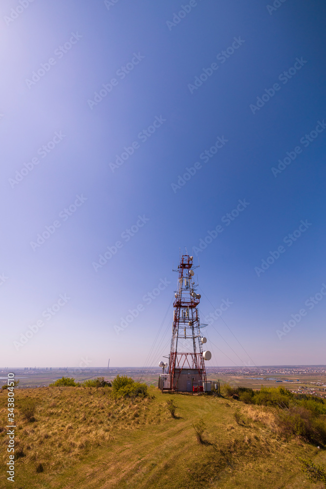 telecommunications tower with antennas on the hill