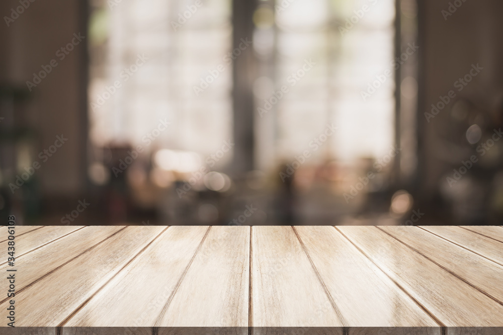 Empty wooden table top with lights bokeh on blur restaurant background Empty wooden table top with lights bokeh on blur restaurant background