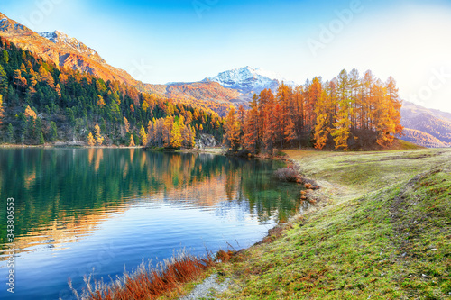 Spectacular autumn view of Champfer lake.