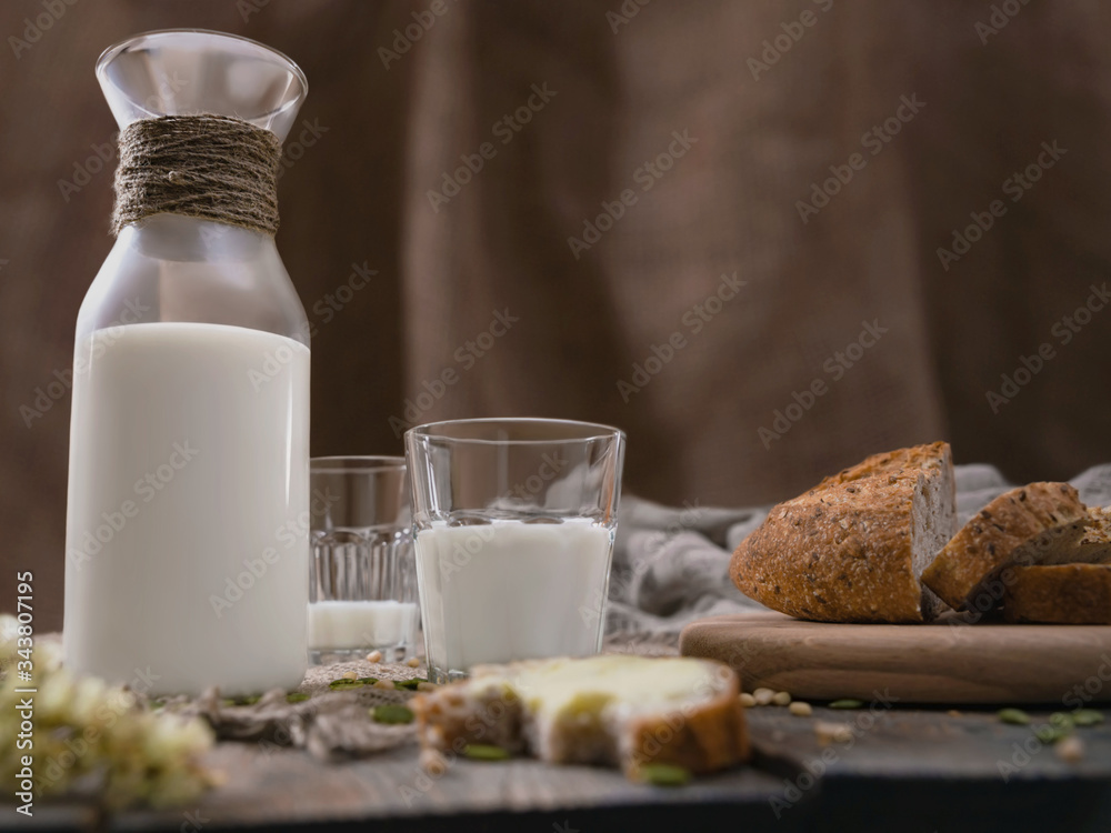 Rustic breakfast with milk and bread. World Milk Day on the first of June. Horizontal shot. Rustic breakfast with milk and bread. World Milk Day on the first of June. Horizontal shot.