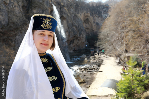 Woman posing in traditional Karachai clothes photo