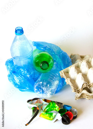 Ecology. The concept of utilization of household garbage on a white background.