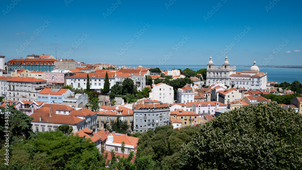 Old Lisbon. A panoramic view over the rooftops of the Old Town of the Portuguese capital of Lisbon on a bright and sunny summers day.