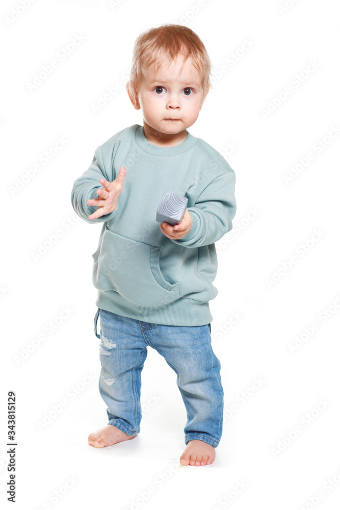 Fashionable portrait of a charming baby boy in a mint sweatshirt Fashionable portrait of a charming baby boy in a mint sweatshirt