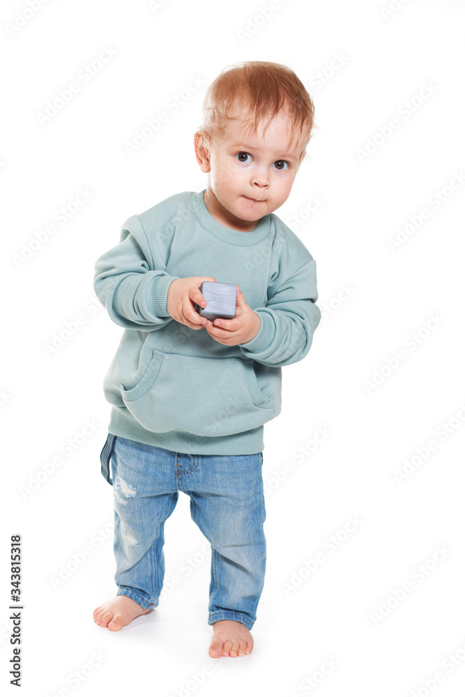 Fashionable portrait of a charming baby boy in a mint sweatshirt Fashionable portrait of a charming baby boy in a mint sweatshirt