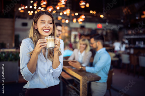 Portrait of happy beautiful business woman on coffee breakdoor