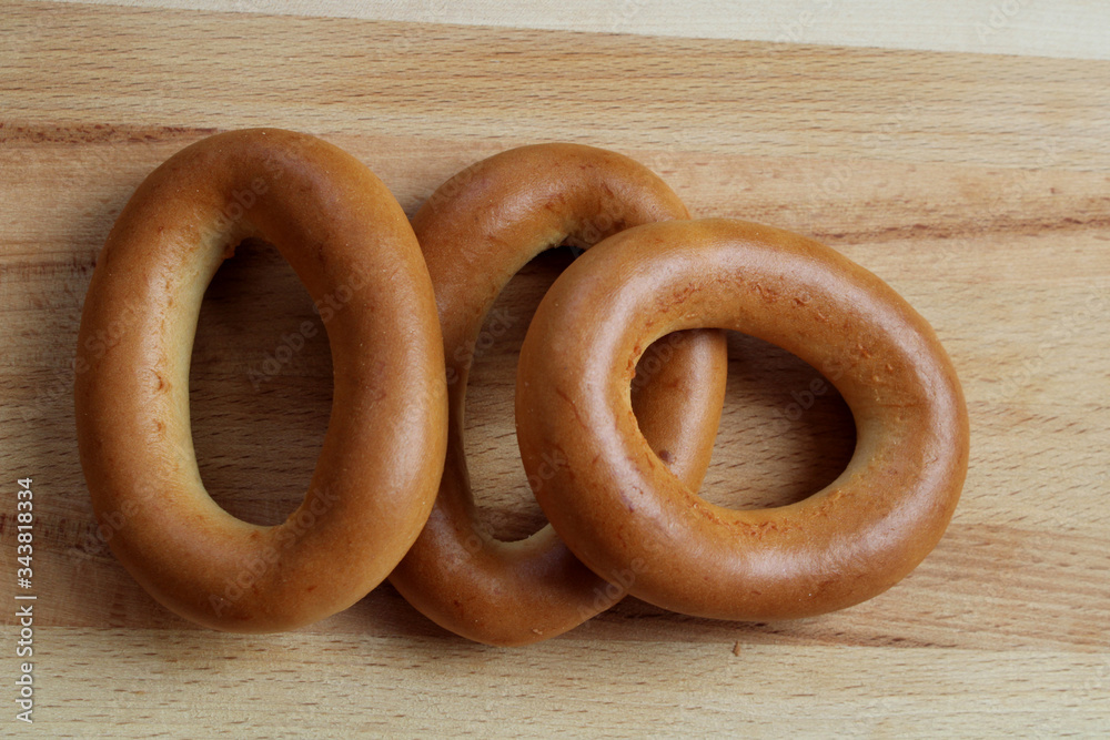three bagels on a wooden Board in the afternoon three bagels on a wooden Board in the afternoon