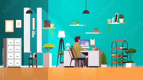 woman freelancer using computer monitor working at home during coronavirus quarantine self-isolation freelance concept modern living room interior horizontal full length vector illustration