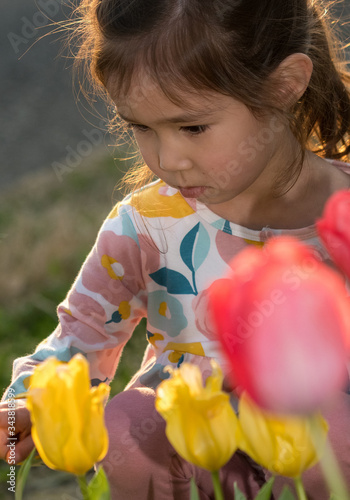 little child playing with flowers © Murf Murphy 