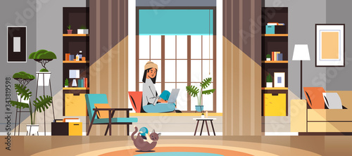 woman freelancer using laptop working at home during coronavirus quarantine self-isolation freelance social distancing concept living room interior full length horizontal vector illustration