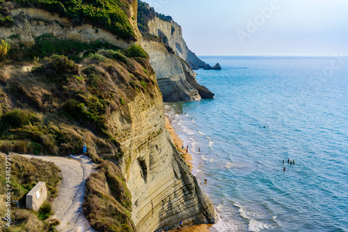 Loggas beach at Peroulades is a paradise beach at  high rocky white cliff and crystal clear azure water in Corfu, close to Cape Drastis, Ionian island, Greece, Europe photo