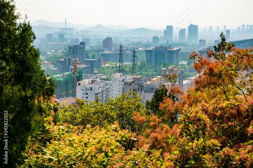 city view of Jinan from Mount Langmao. Jinan is surrounded by mountains.  photo