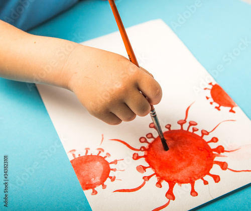 Hand od child painting with water-colors molecule Corona virus. World health coronavirus outbreak and international public infectious disease  coronaviruses influenza as a pandemic medical conceptin photo